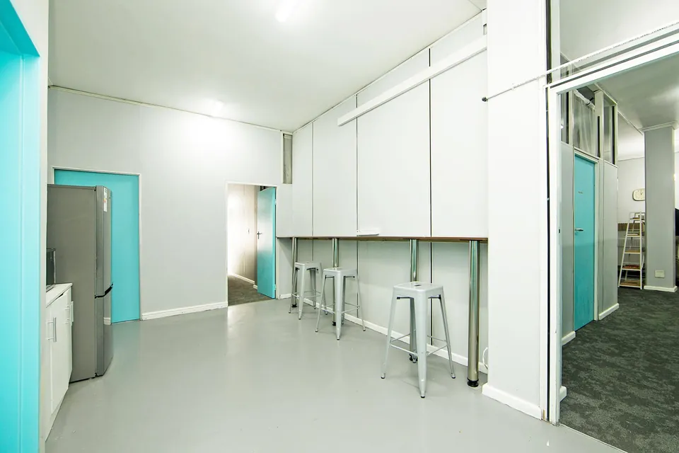 Common area with stools and a long counter